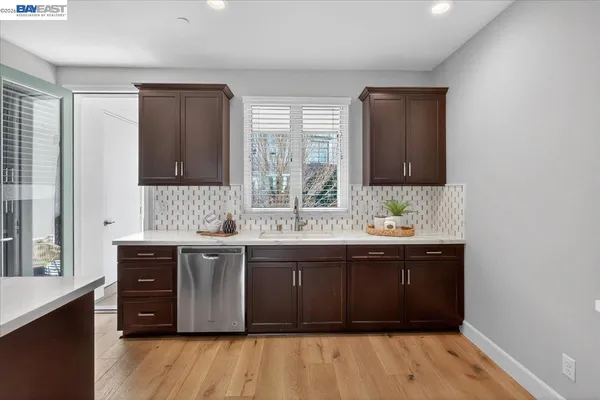a view of a patio with table and chairs and potted plants