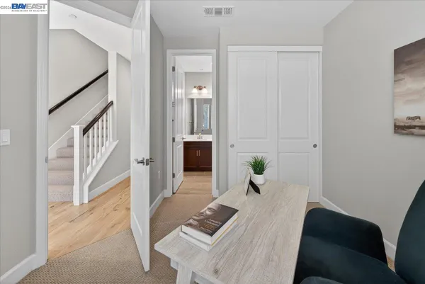 a bathroom with a sink and mirror with toilet