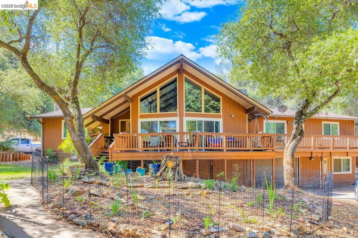 8733 Fraguero Road Sonora, CA 95370 - Photo 2 of 73 Multi-level residence featuring a prominent A-frame architectural element and extensive wood siding