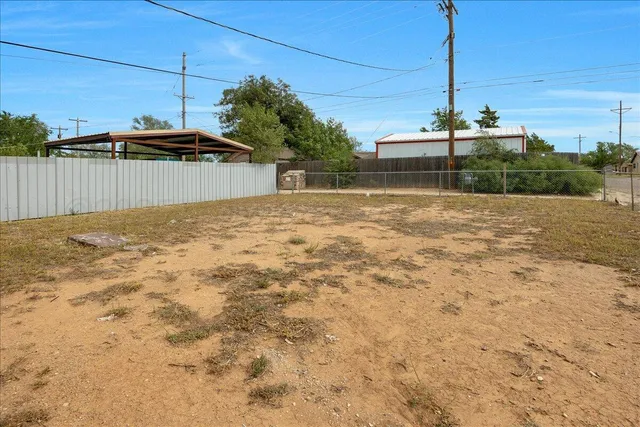 a bathroom with a sink mirror vanity and toilet