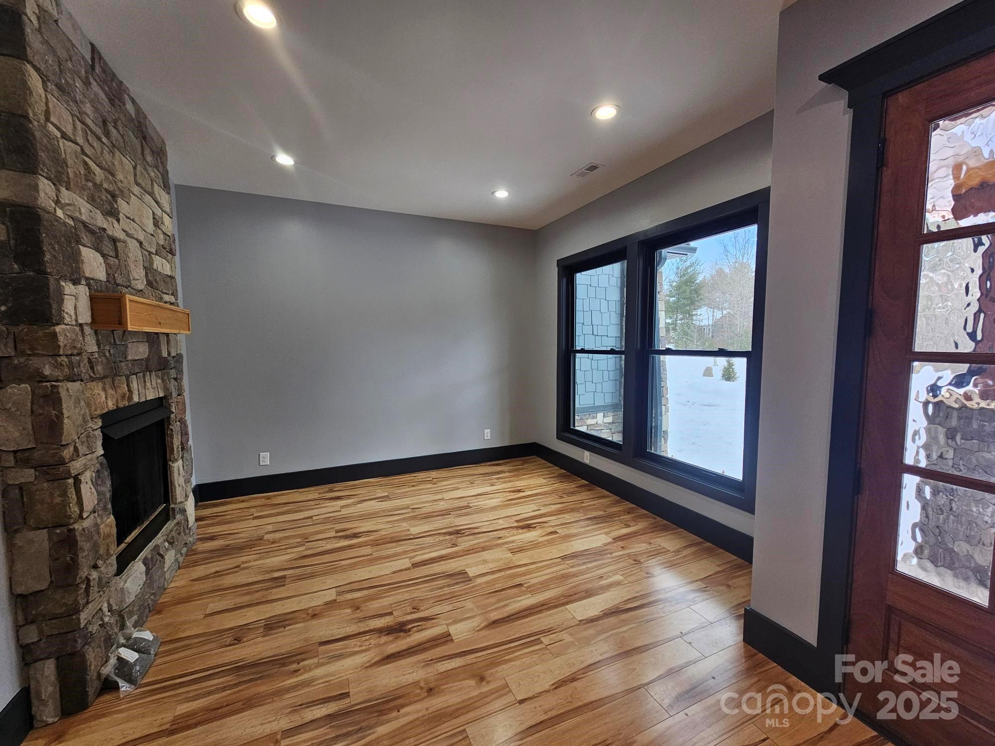 1076 Table View Drive, Unit 55 Morganton, NC 28655 - Photo 16 of 33 a view of an empty room with a fireplace and a window