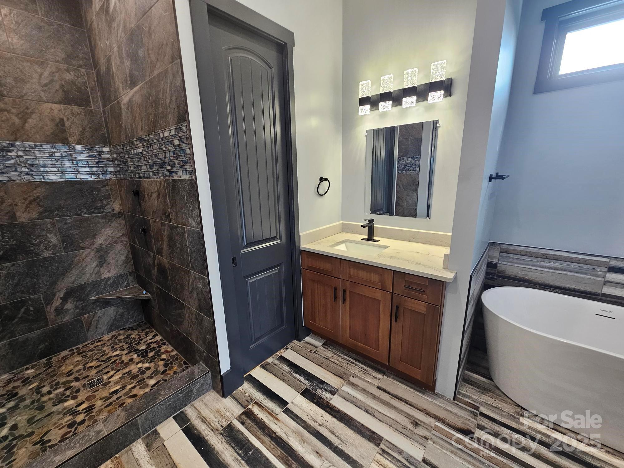 1076 Table View Drive, Unit 55 Morganton, NC 28655 - Photo 26 of 33 a bathroom with a double vanity sink and mirror
