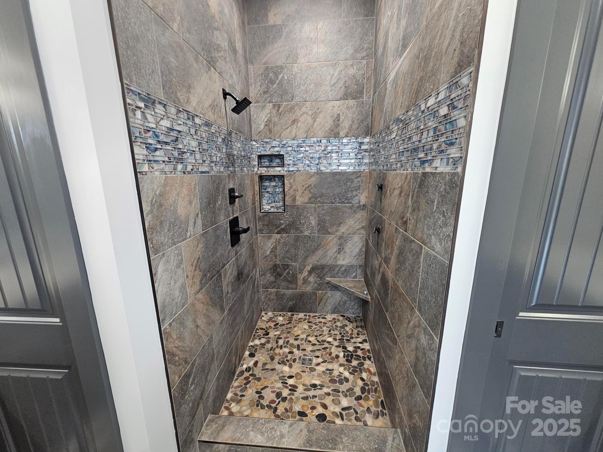 1076 Table View Drive, Unit 55 Morganton, NC 28655 - Photo 27 of 33 a bathroom with a shower and a toilet