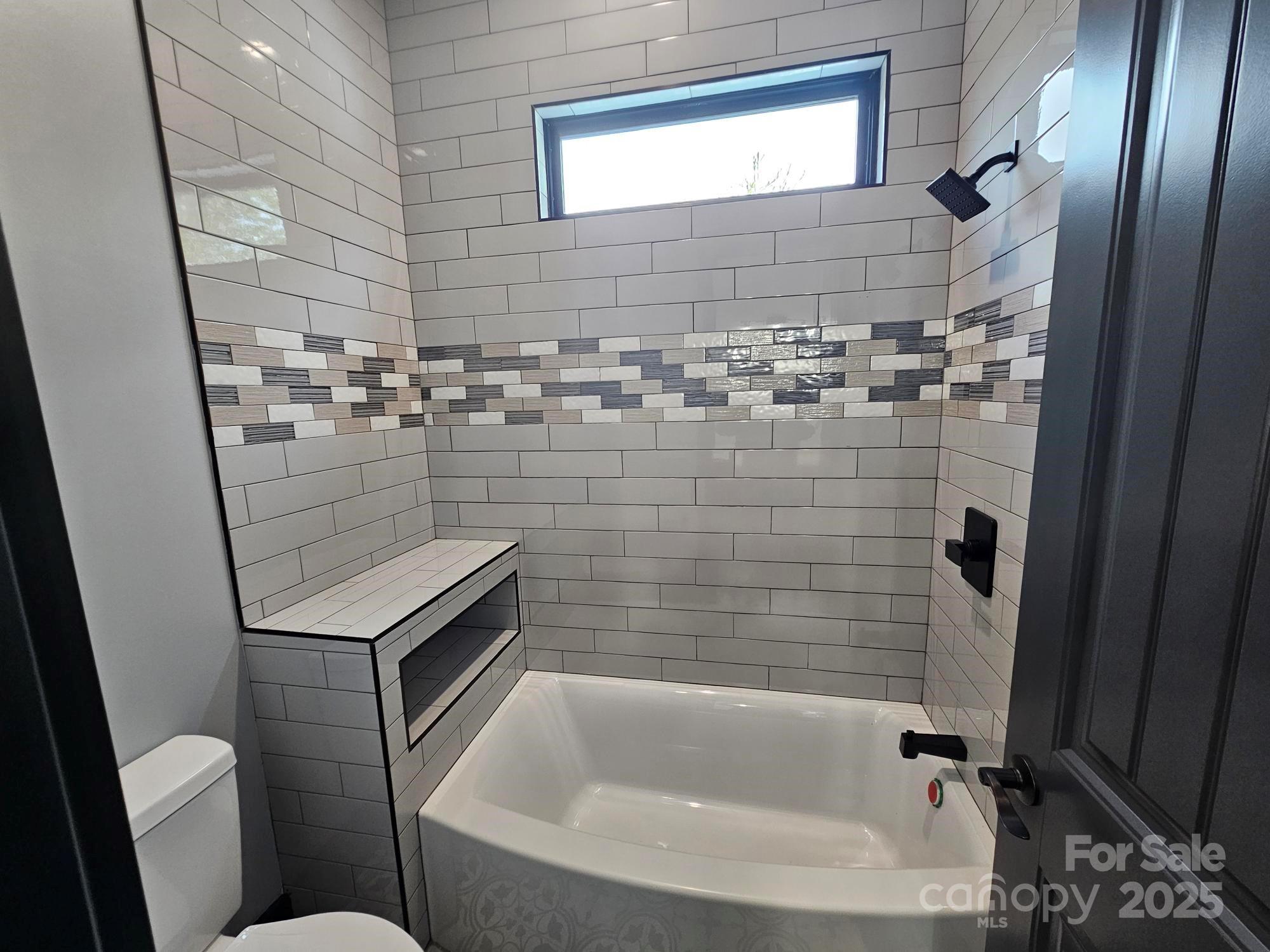 1076 Table View Drive, Unit 55 Morganton, NC 28655 - Photo 4 of 33 a bathroom with a sink a toilet and shower