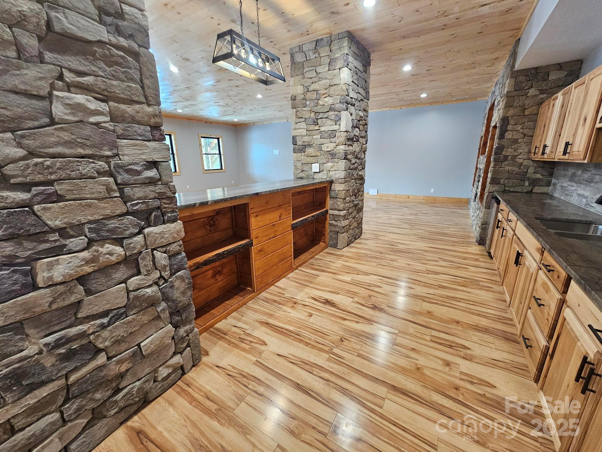 1076 Table View Drive, Unit 55 Morganton, NC 28655 - Photo 7 of 33 a kitchen with stainless steel appliances wooden cabinets and a counter top space