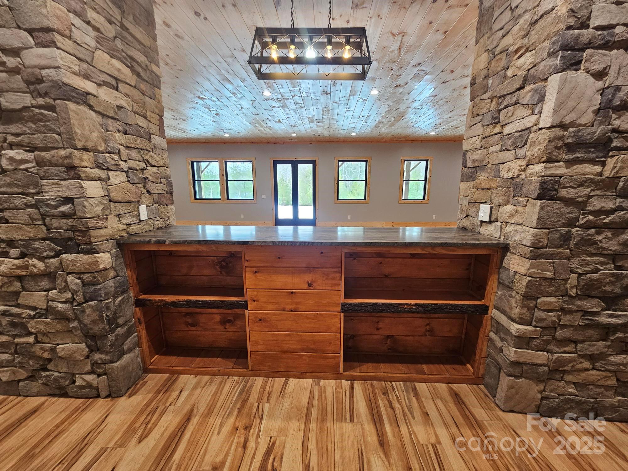 1076 Table View Drive, Unit 55 Morganton, NC 28655 - Photo 8 of 33 a kitchen with a wooden floor and a fireplace