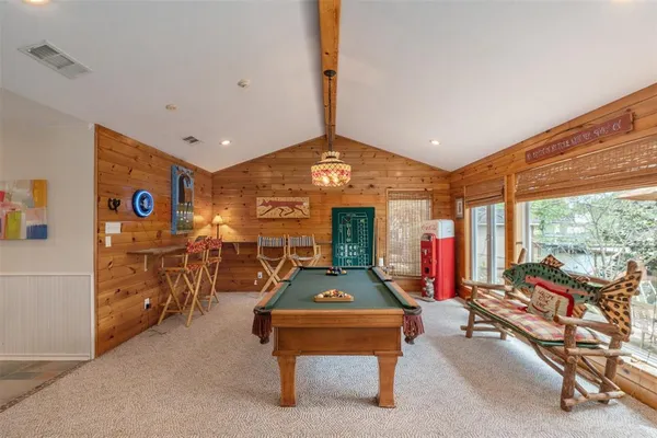 a room with lots of furniture and windows