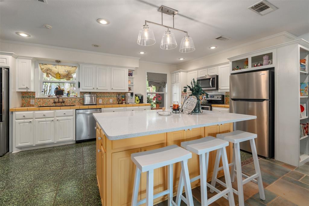 471 Stirrup Ranch Road Trinidad, TX 75163 - Photo 18 of 40 Huge granite island holds 6 stools