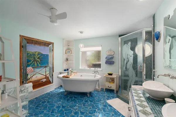 a spacious bathroom with a double vanity sink a mirror and a bathtub