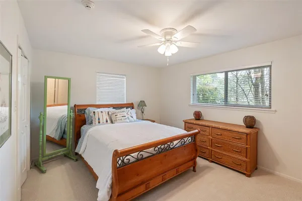 a bed room with a bed and a window