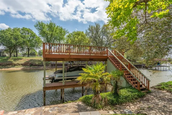a view of a lake with a bench next to a lake