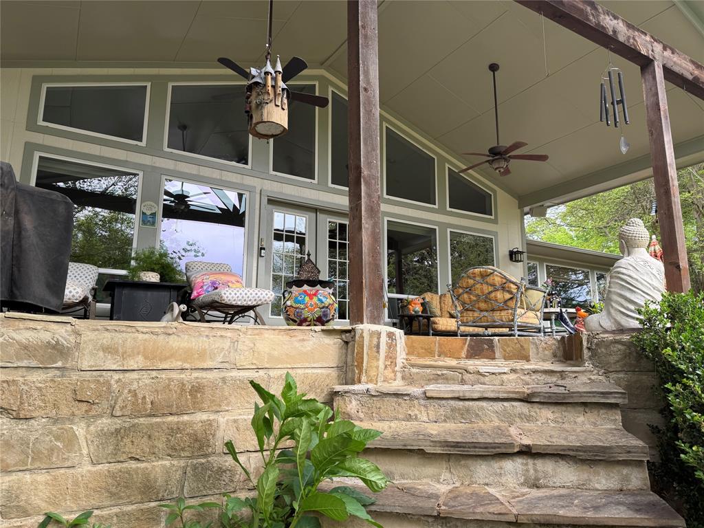 471 Stirrup Ranch Road Trinidad, TX 75163 - Photo 6 of 40 View of back patio coming up the stairs to lake