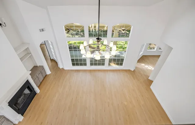 a view of dining room with furniture wooden floor and window
