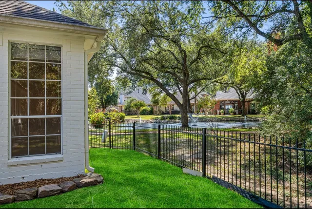 a view of outdoor space with garden and trees
