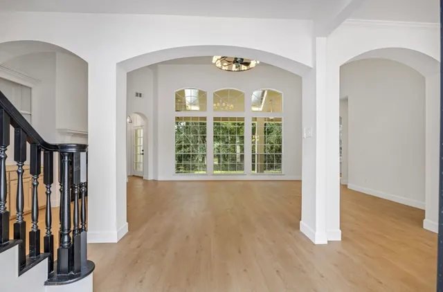 a view of an entryway with wooden floor