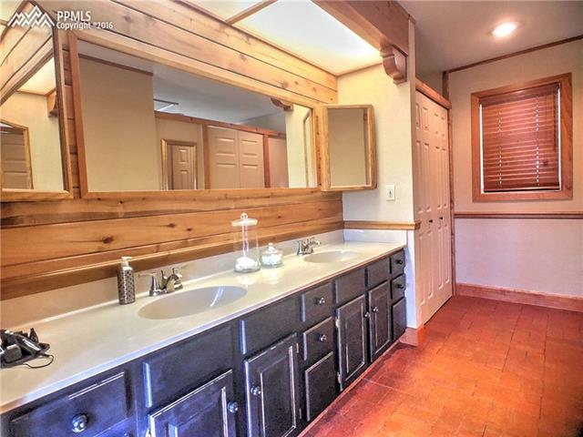 10380 Link Road Fountain, CO 80817 - Photo 16 of 35 Master bath double vanity and access to large walk in closet.