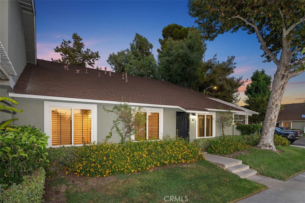 5417 Pine Ridge Way, Unit A Anaheim, CA 92807 - Photo 1 of 1 a front view of a house with garden
