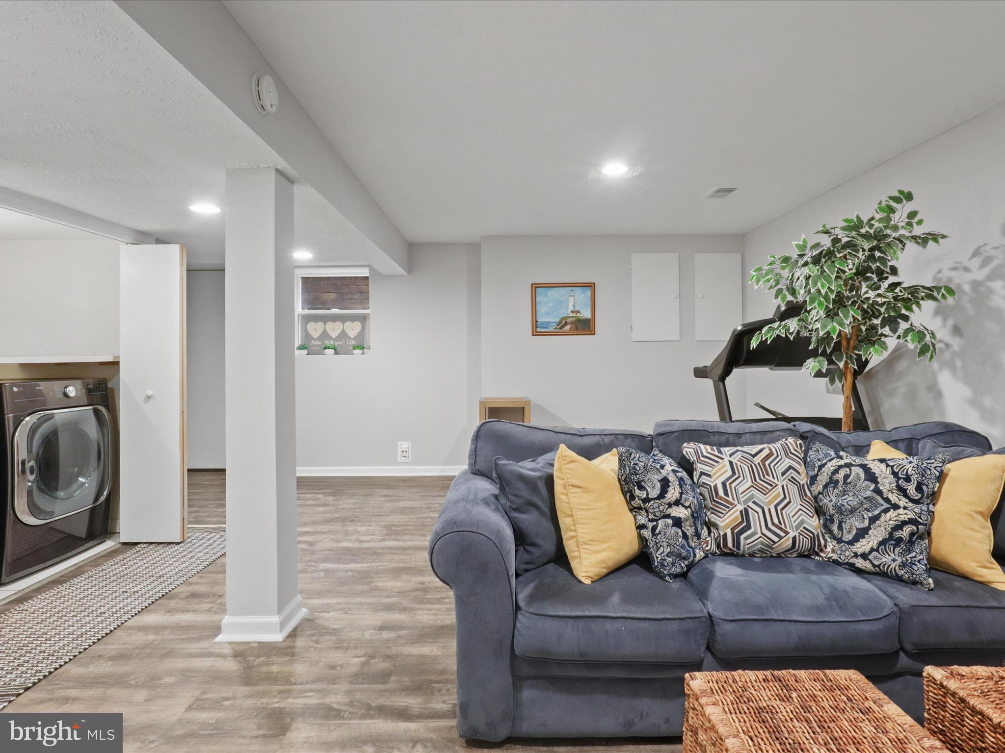 6558 Gildar Street Alexandria, VA 22310 - Photo 27 of 53 a living room with furniture and a fireplace