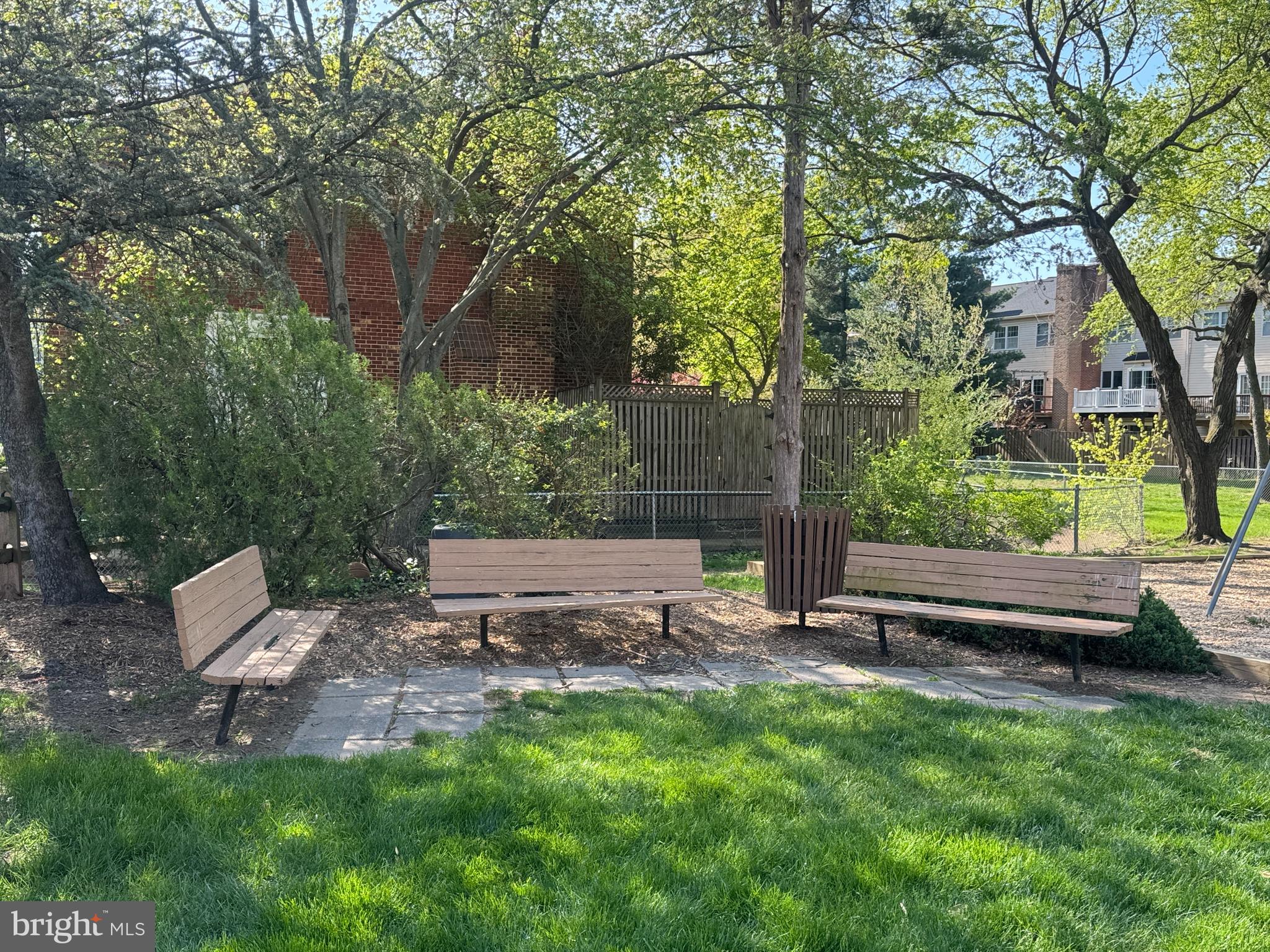 6558 Gildar Street Alexandria, VA 22310 - Photo 32 of 53 a view of a backyard with lawn chairs and a fire pit