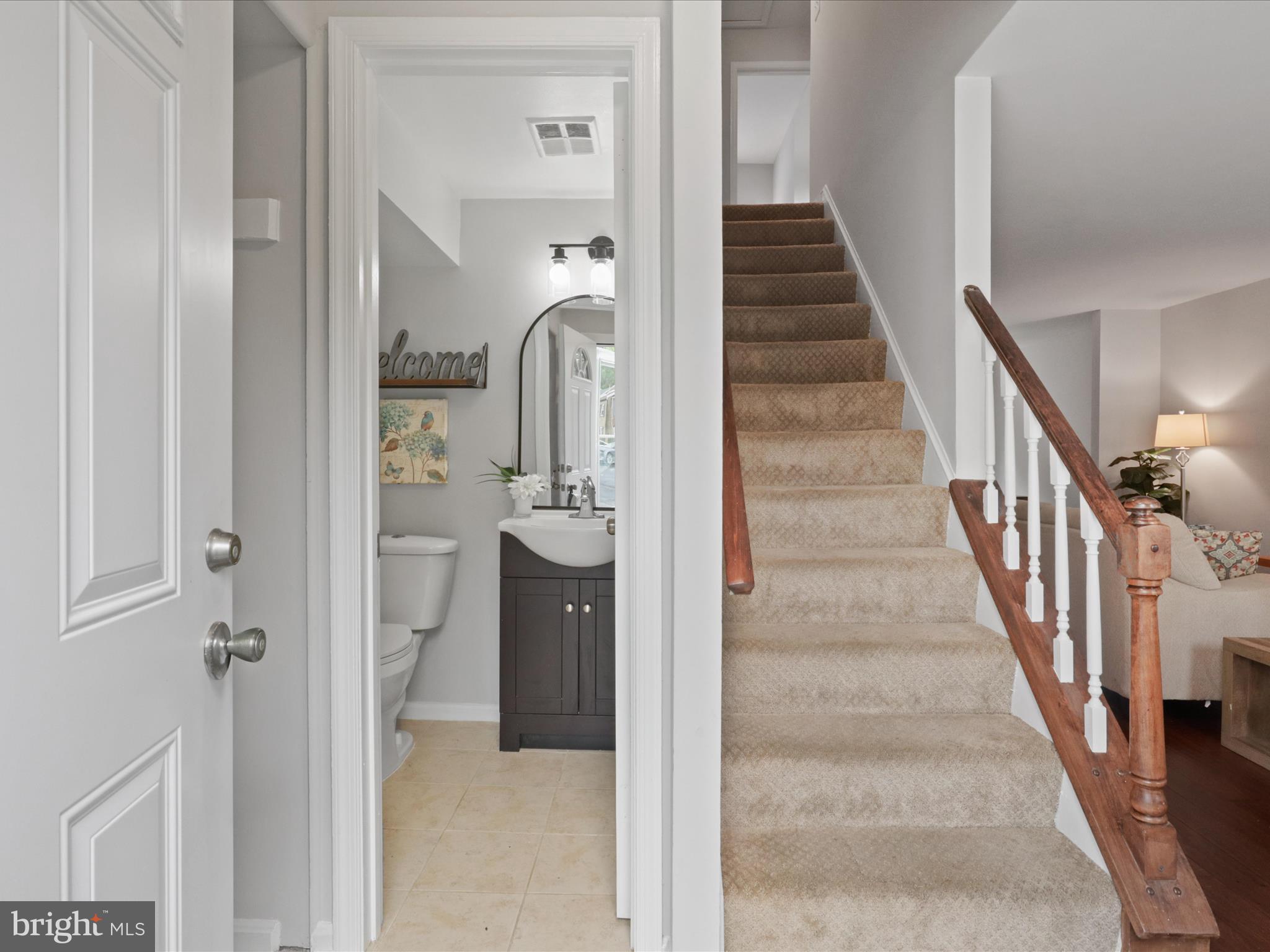 6558 Gildar Street Alexandria, VA 22310 - Photo 4 of 53 a view of a hallway with wooden floor and entryway