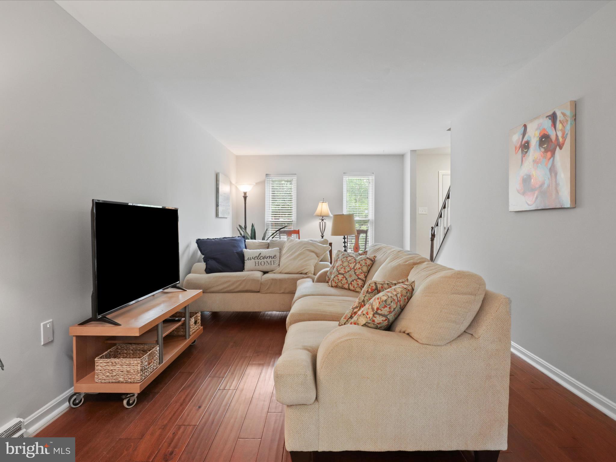 6558 Gildar Street Alexandria, VA 22310 - Photo 6 of 53 a living room with furniture and a flat screen tv