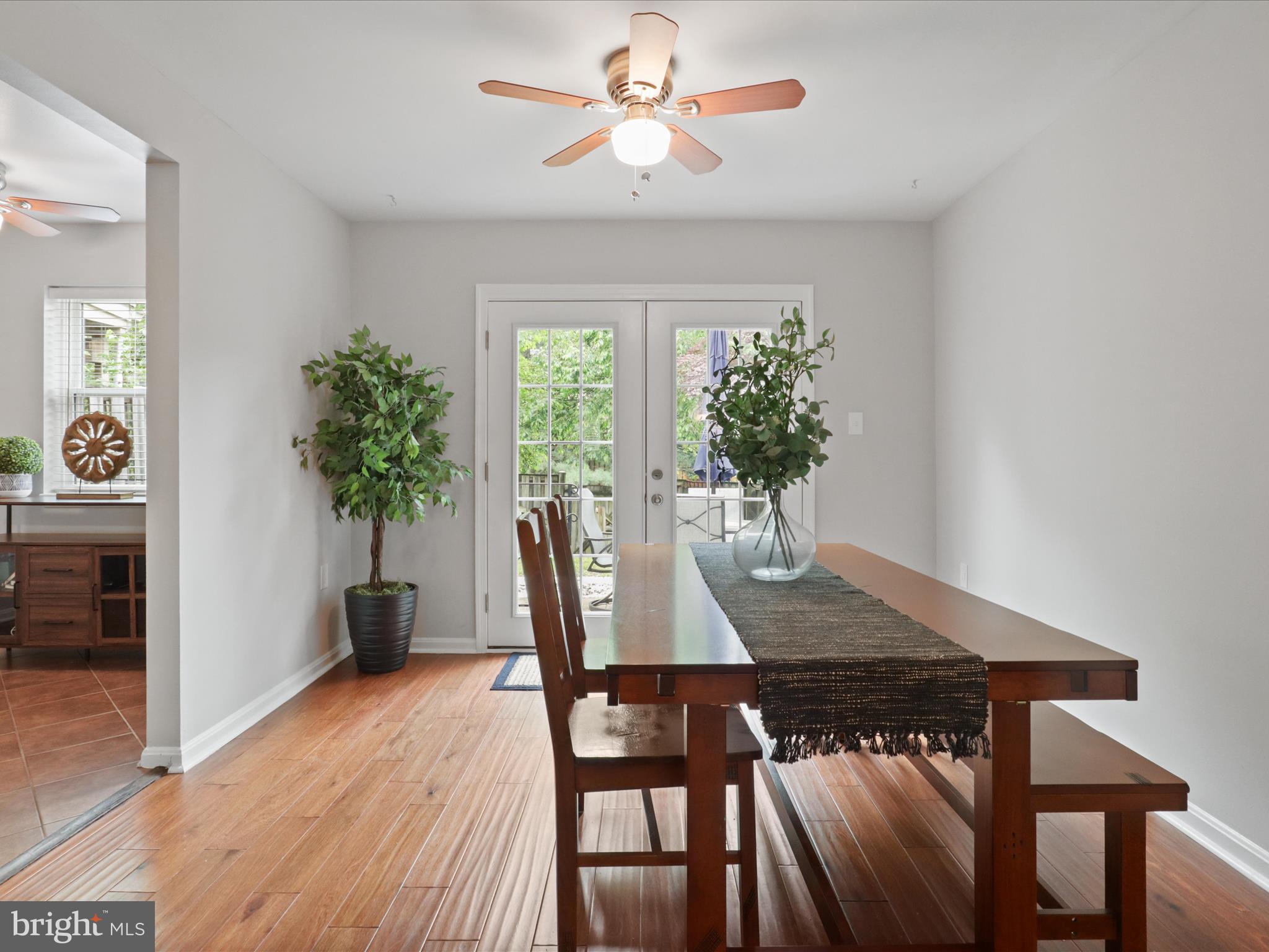 6558 Gildar Street Alexandria, VA 22310 - Photo 7 of 53 a view of a dining room with furniture window and wooden floor