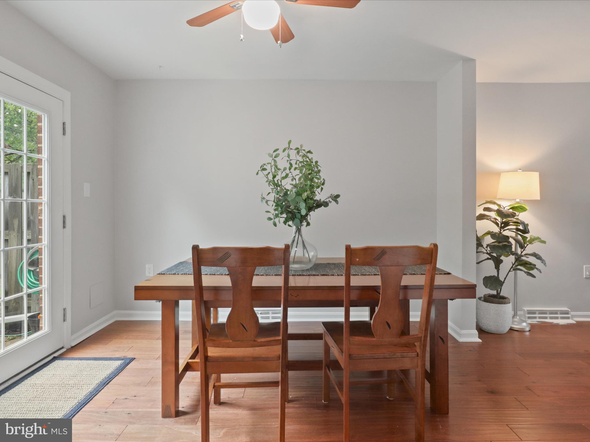 6558 Gildar Street Alexandria, VA 22310 - Photo 8 of 53 a dining room with furniture and wooden floor
