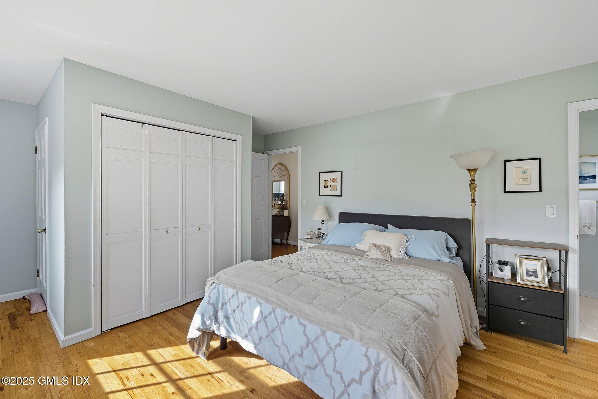 25 Buxton Lane Riverside, CT 06878 - Photo 11 of 16 a bedroom with a bed and cabinets