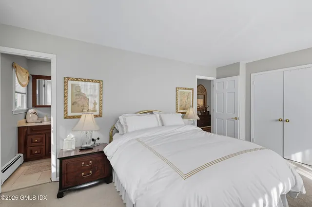 a bedroom with a bed and a closet