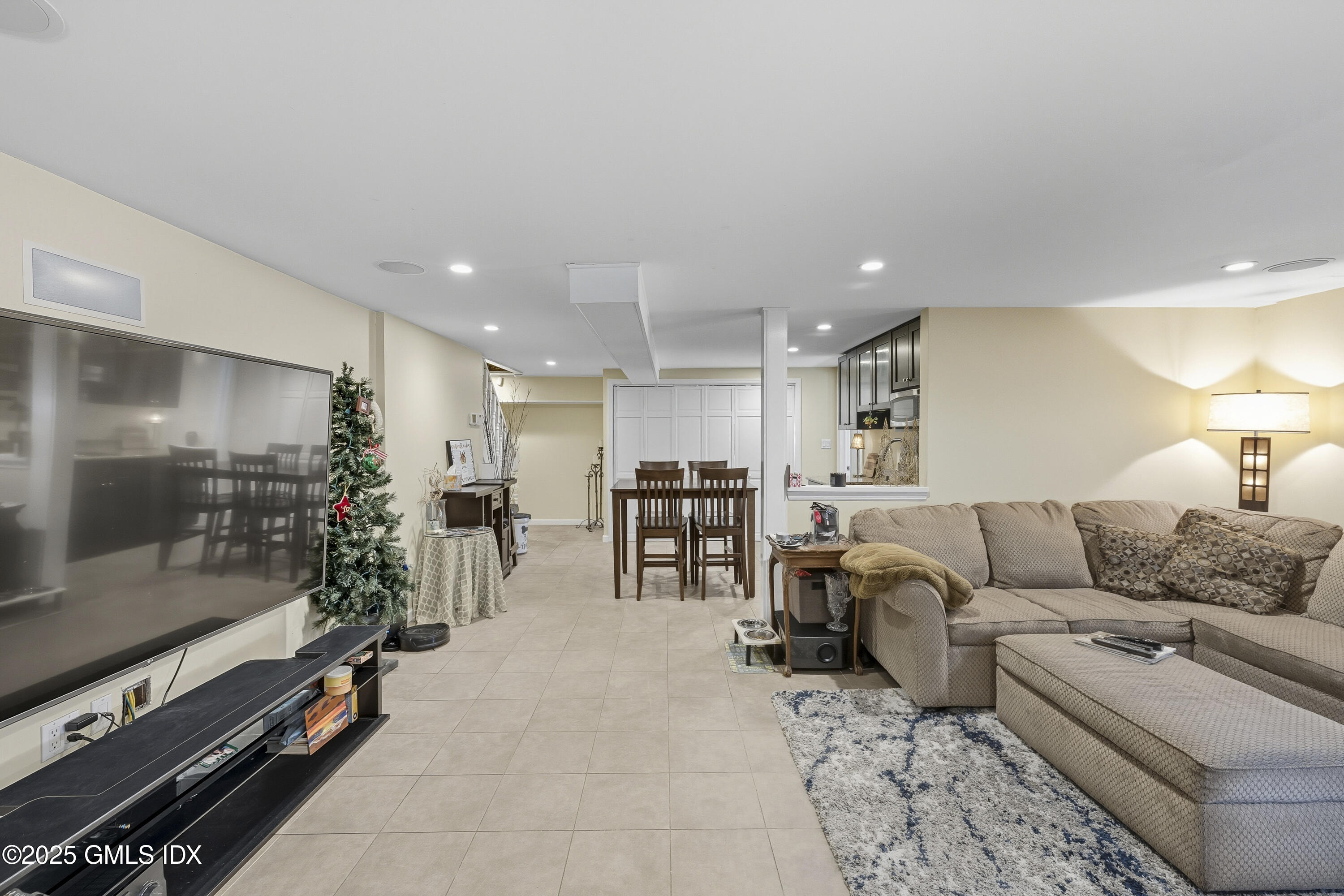 25 Buxton Lane Riverside, CT 06878 - Photo 13 of 16 a living room with furniture and a flat screen tv