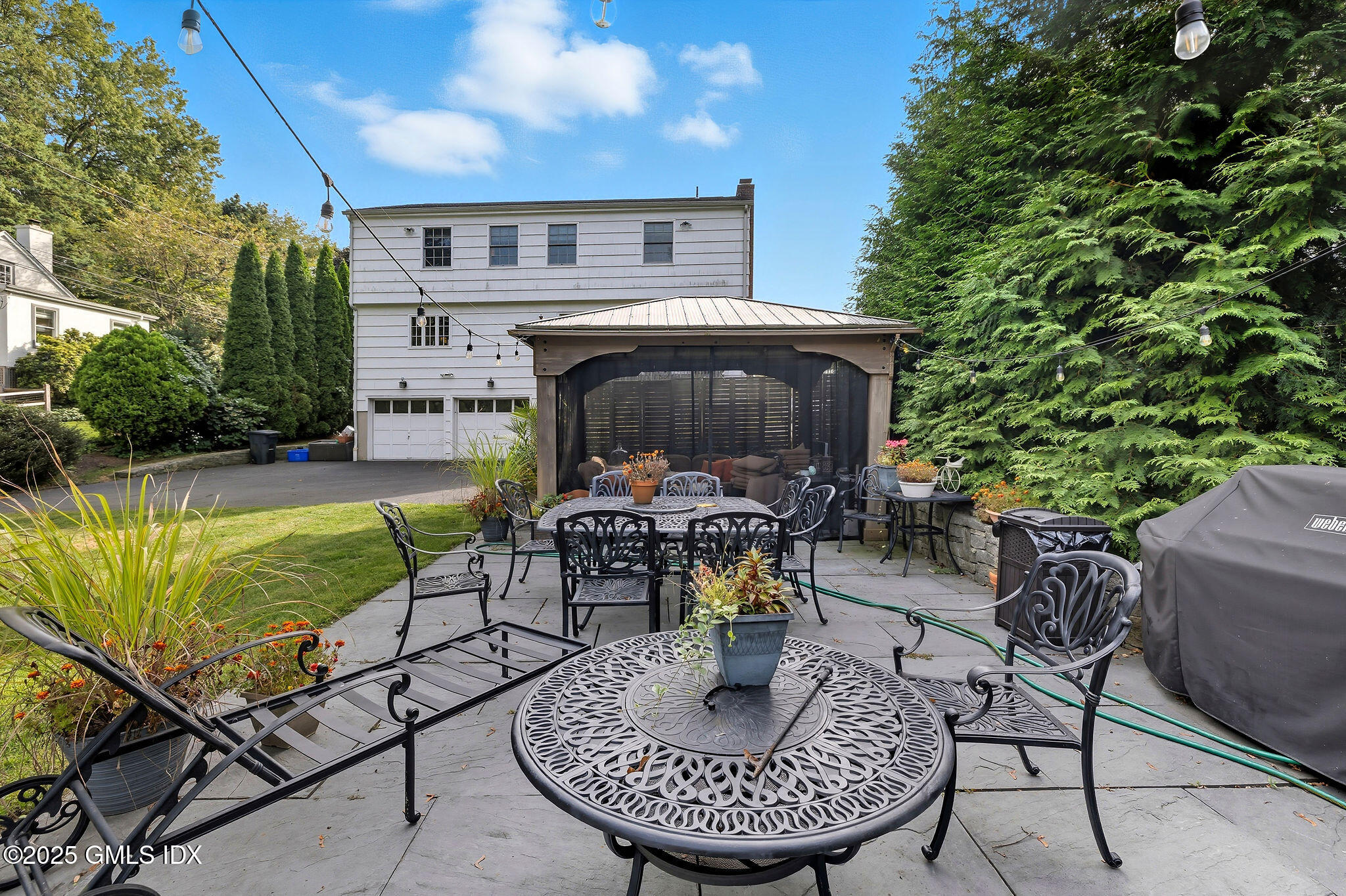 25 Buxton Lane Riverside, CT 06878 - Photo 14 of 16 a view of a house with swimming pool and sitting area