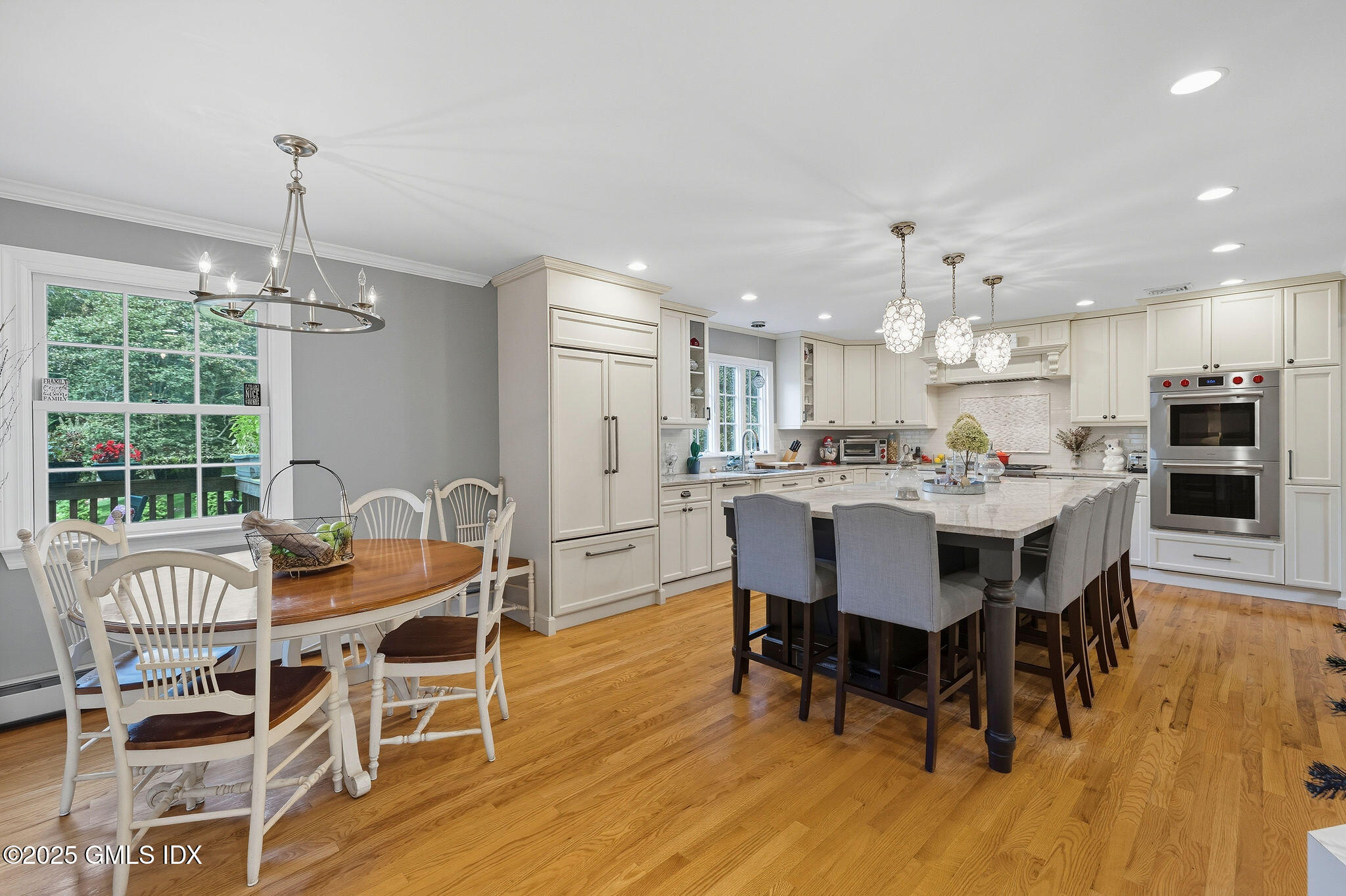 25 Buxton Lane Riverside, CT 06878 - Photo 3 of 16 a dining room with furniture a chandelier and wooden floor
