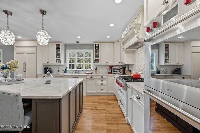 a kitchen with cabinets and window