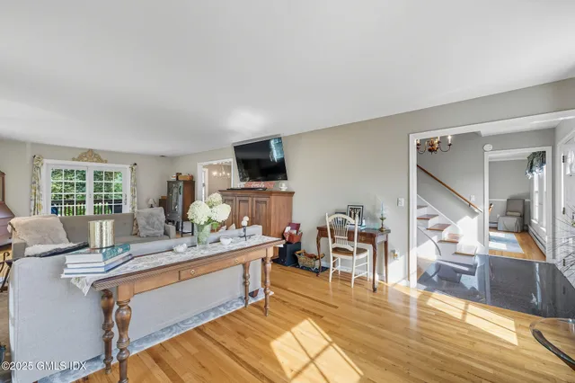 a work room with furniture and a flat screen tv