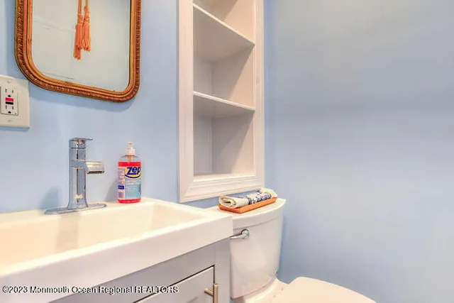 a stove top oven sitting inside of a kitchen