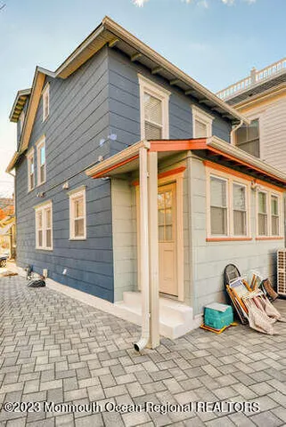 a view of a chair and tables in the balcony