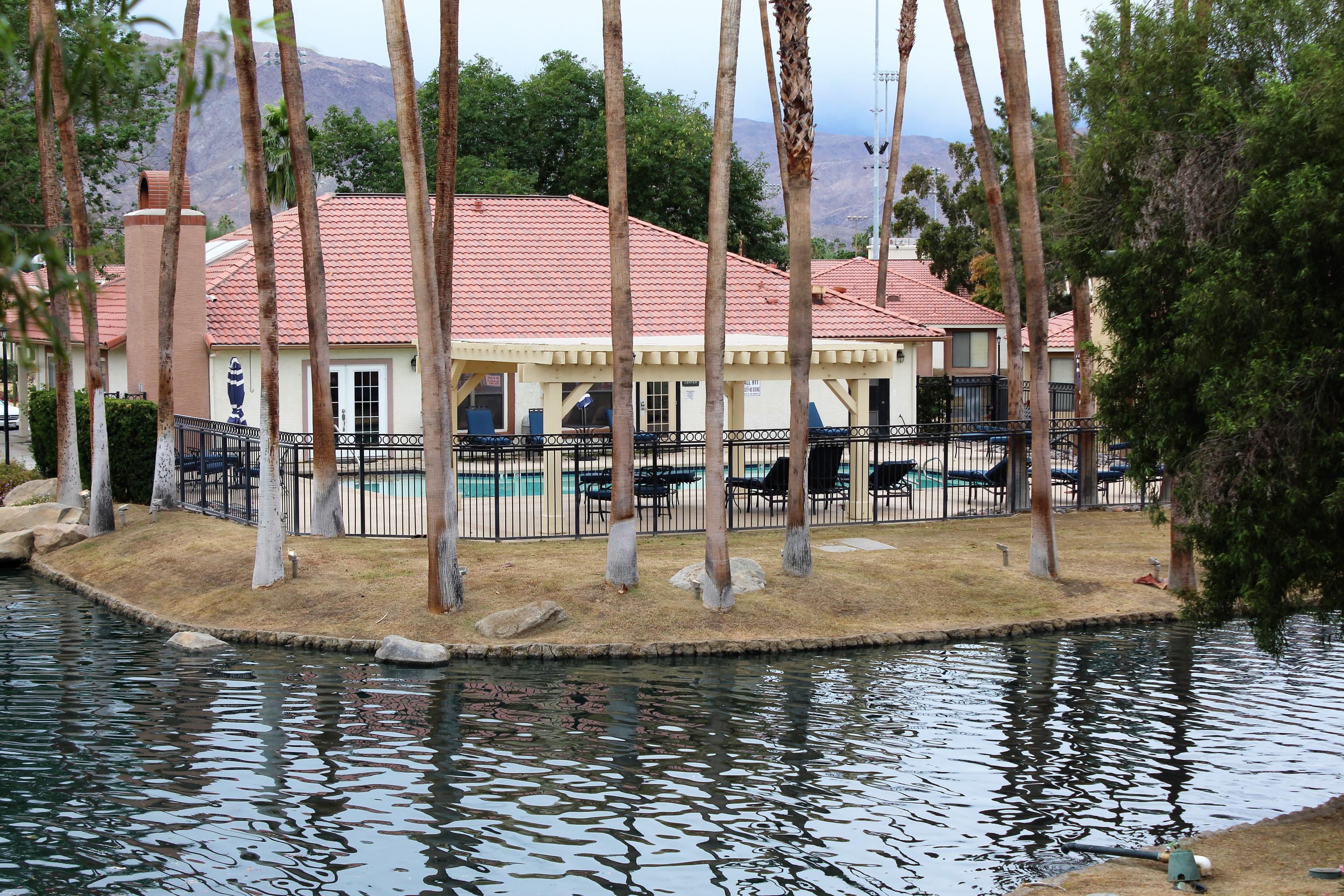 43376 Cook Street, Unit 88 Palm Desert, CA 92211 - Photo 1 of 13 a view of swimming pool with outdoor seating