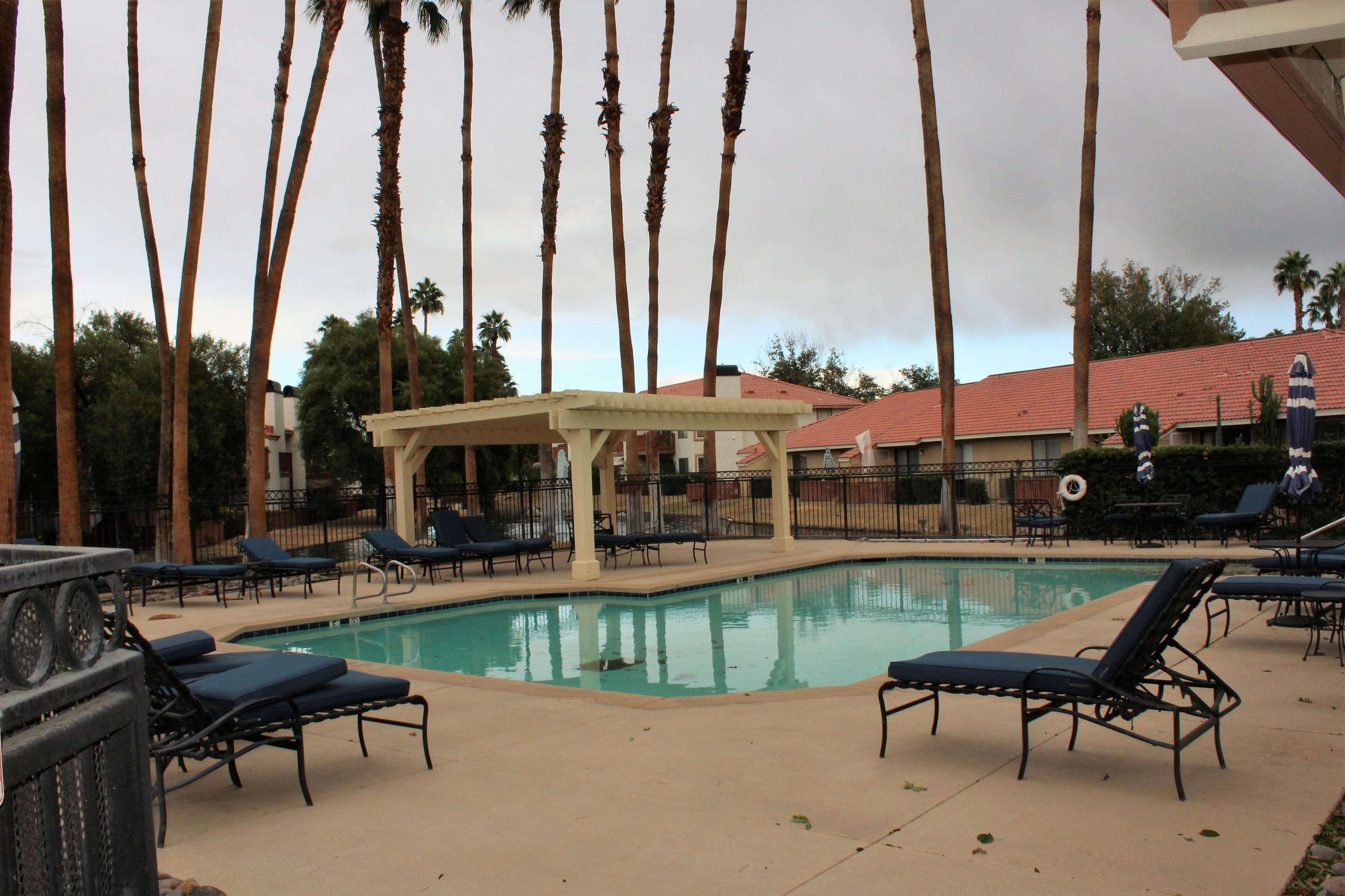 43376 Cook Street, Unit 88 Palm Desert, CA 92211 - Photo 11 of 13 a patio with table and chairs