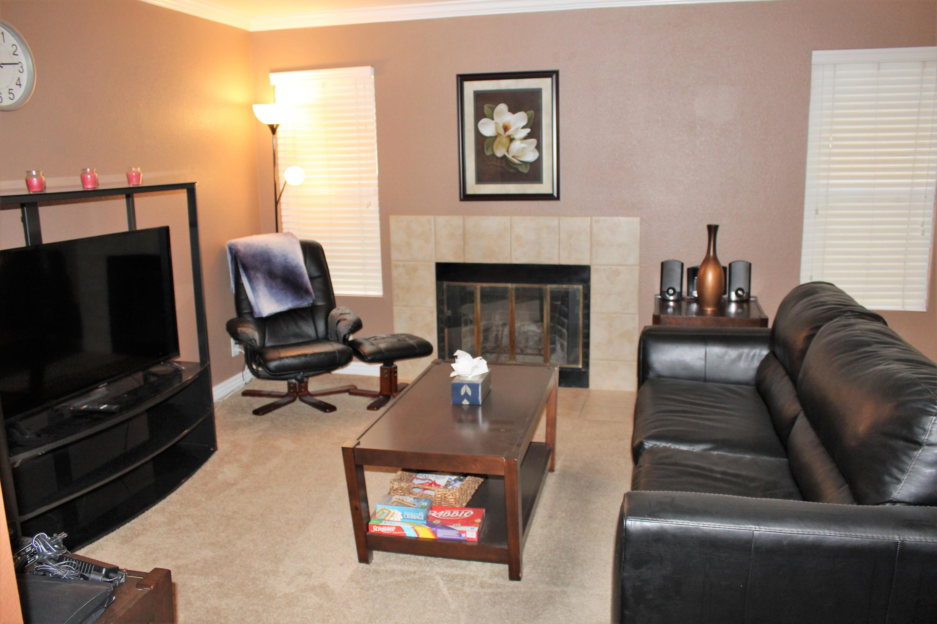 43376 Cook Street, Unit 88 Palm Desert, CA 92211 - Photo 2 of 13 a living room with furniture and a fireplace