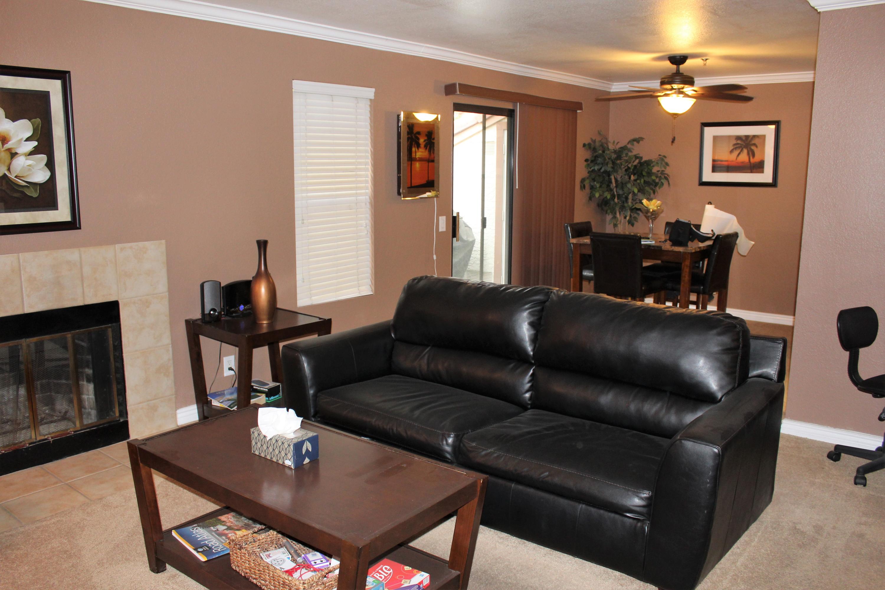 43376 Cook Street, Unit 88 Palm Desert, CA 92211 - Photo 3 of 13 a living room with furniture and a fireplace