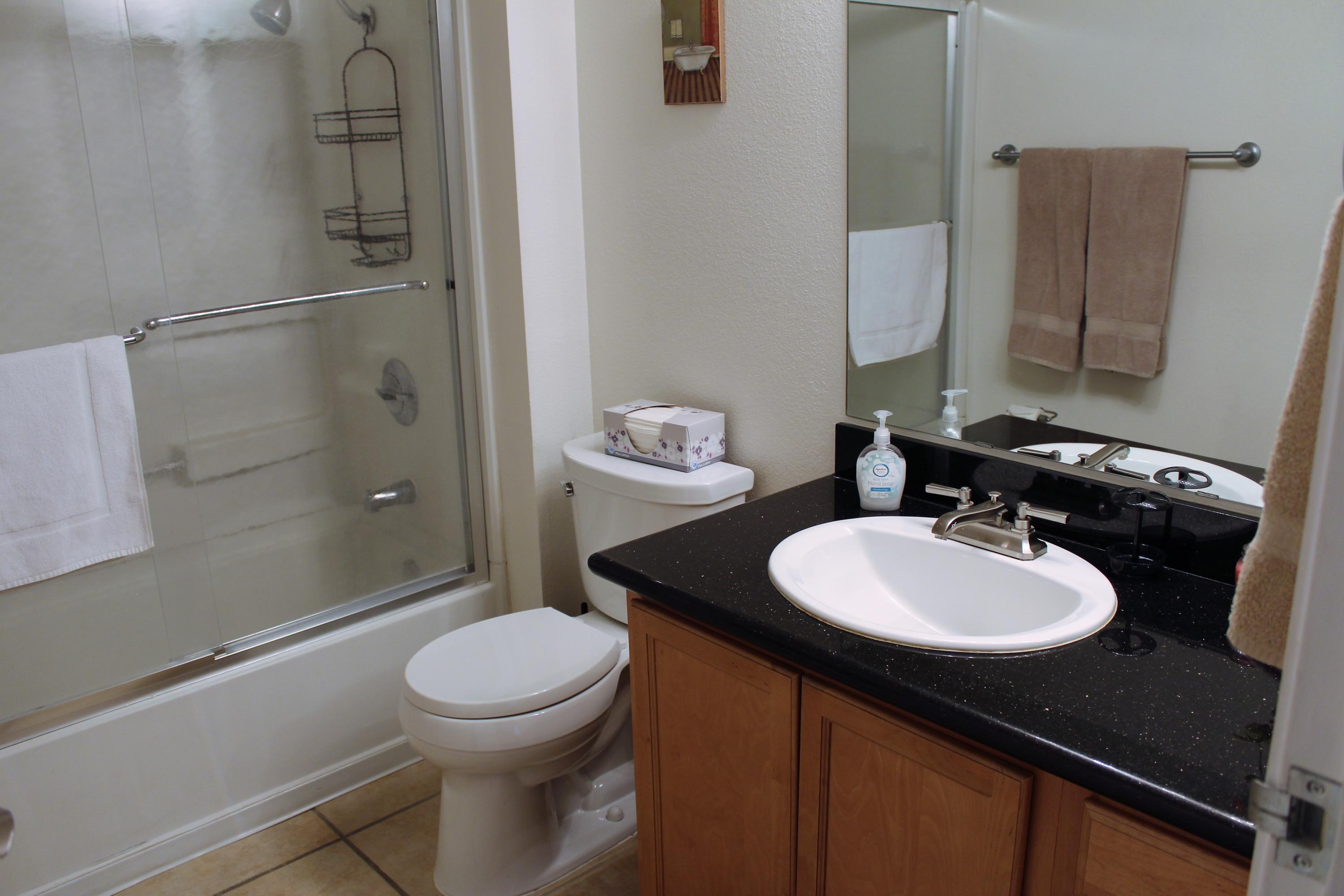 43376 Cook Street, Unit 88 Palm Desert, CA 92211 - Photo 7 of 13 a bathroom with a sink a toilet and shower