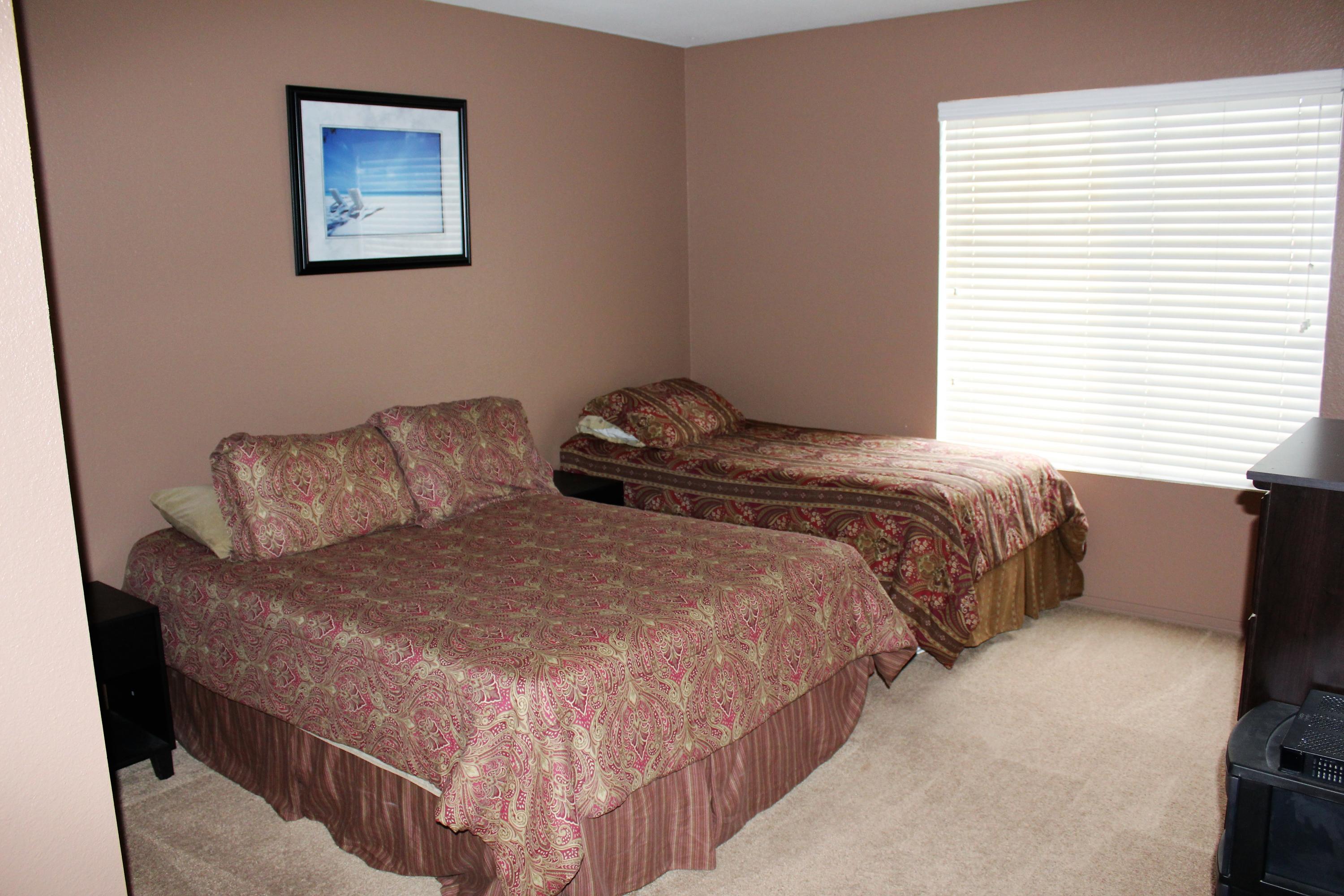 43376 Cook Street, Unit 88 Palm Desert, CA 92211 - Photo 8 of 13 a bedroom with bed and a window