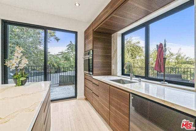 a bedroom with a bed and a potted plant