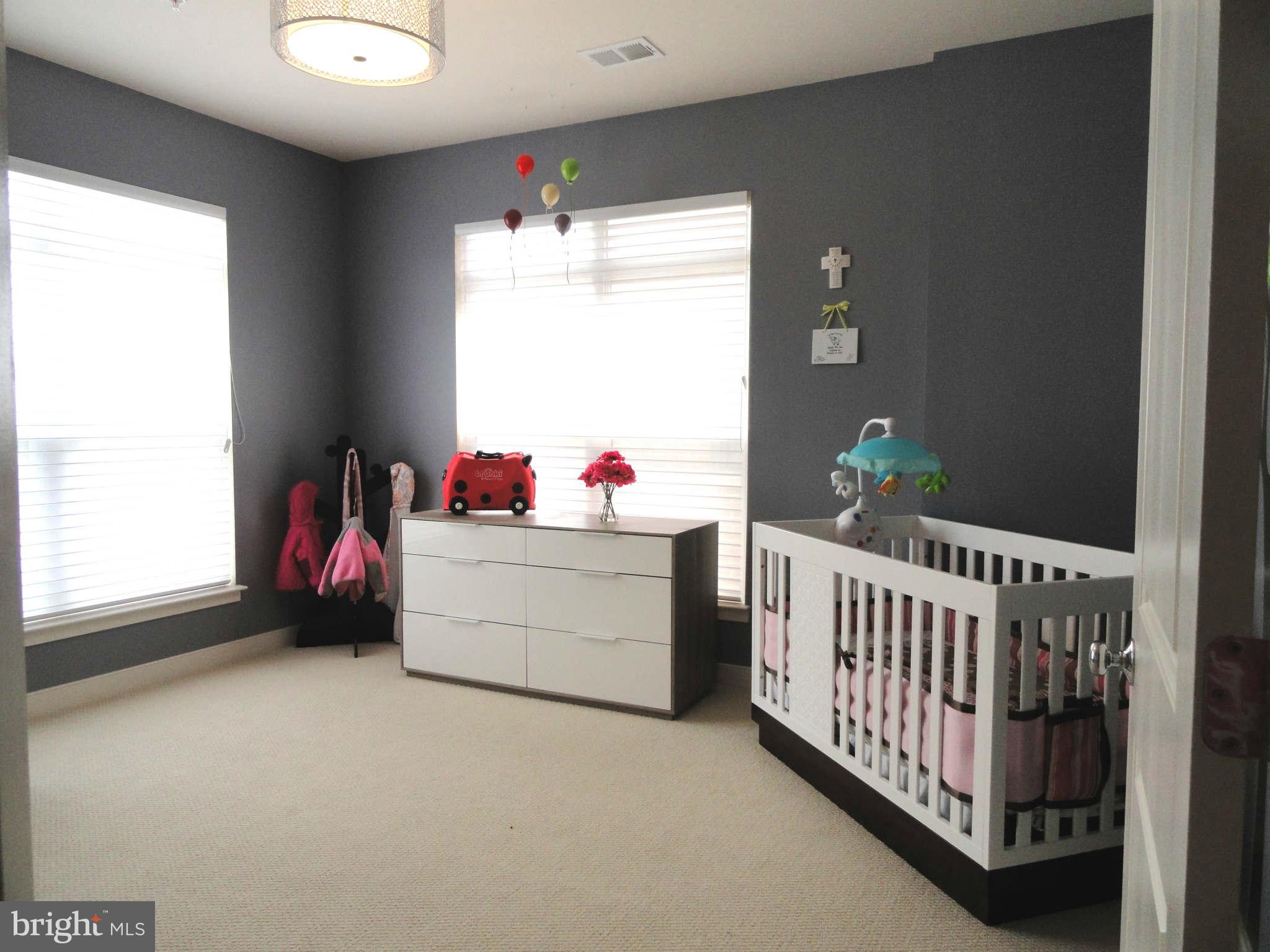 4159 Legato Road Fairfax, VA 22033 - Photo 13 of 25 a bedroom with furniture and a window
