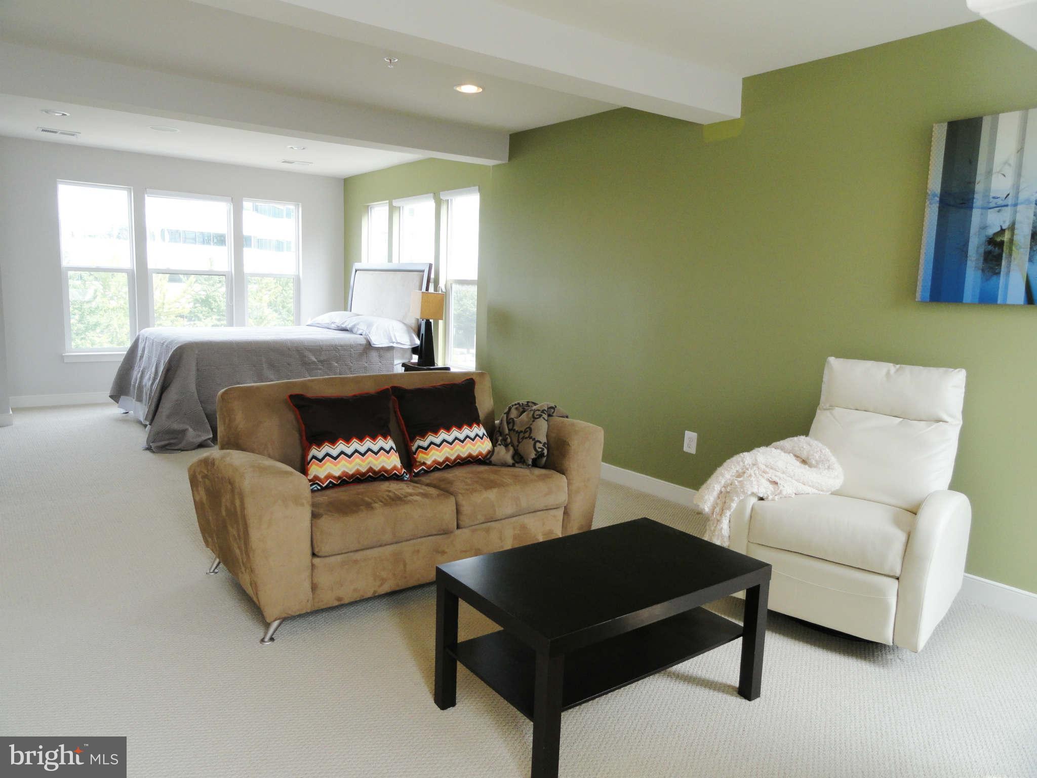 4159 Legato Road Fairfax, VA 22033 - Photo 15 of 25 a living room with furniture and a large window