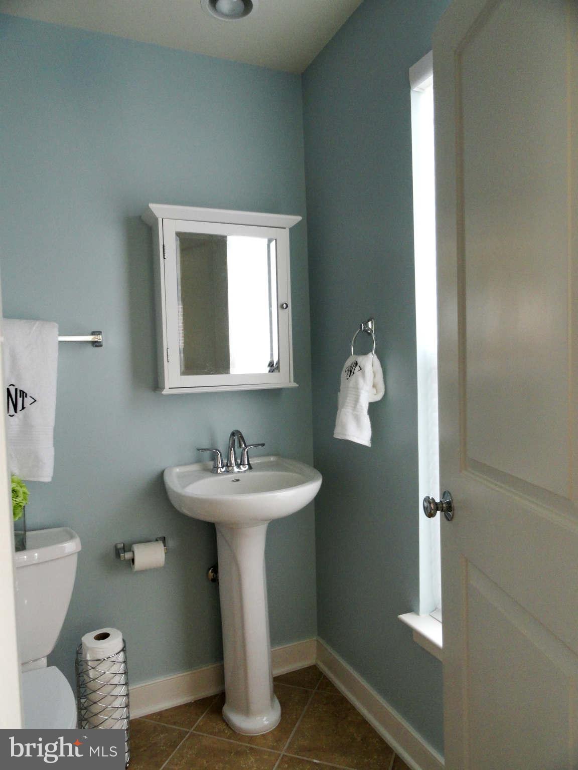 4159 Legato Road Fairfax, VA 22033 - Photo 17 of 25 a bathroom with a sink toilet and mirror