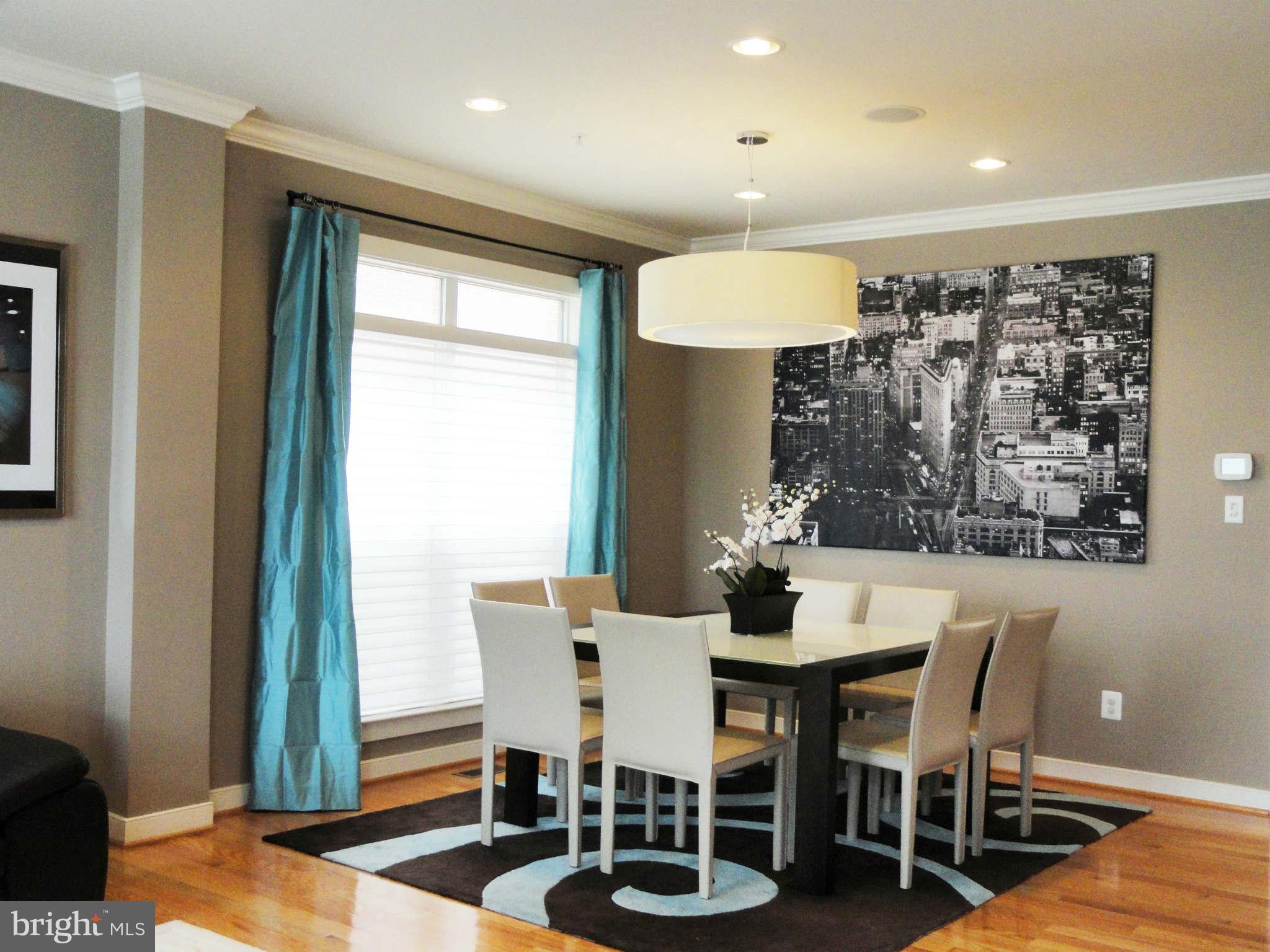 4159 Legato Road Fairfax, VA 22033 - Photo 4 of 25 a view of a dining room with furniture window and wooden floor