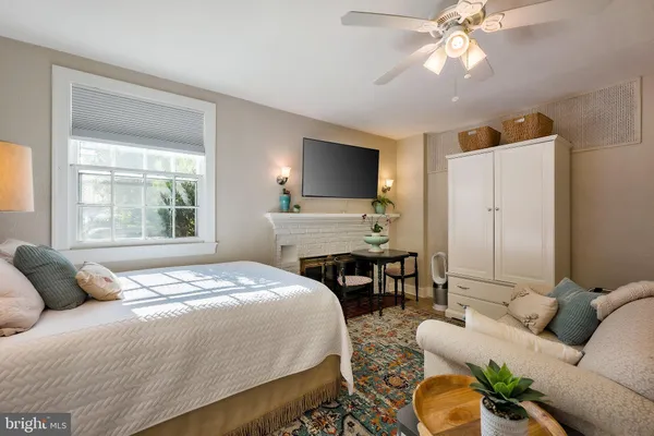 swimming pool view with a seating space