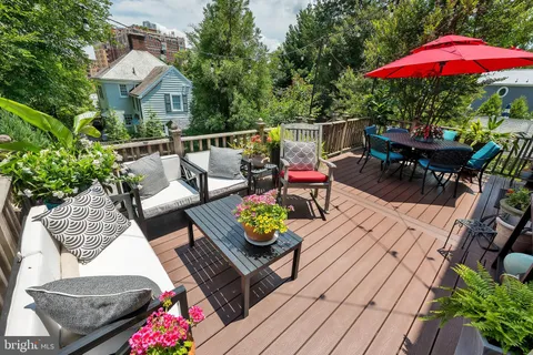 a view of a backyard with sitting area