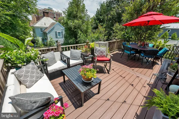 a view of a backyard with sitting area